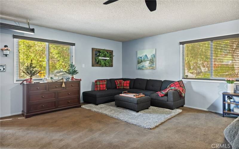 Level entry guest room with sitting area.