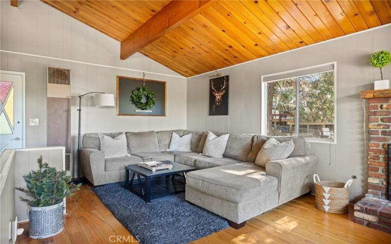 Living room with back deck and yard access.