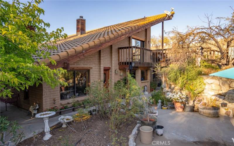 From garden looking onto home. Deck and sliding door goes into the loft