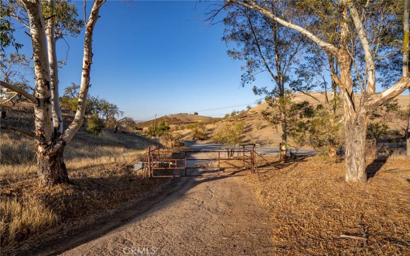 Seperate gated entrance from Lake Nacimiento Dr that goes to detached studio and garage