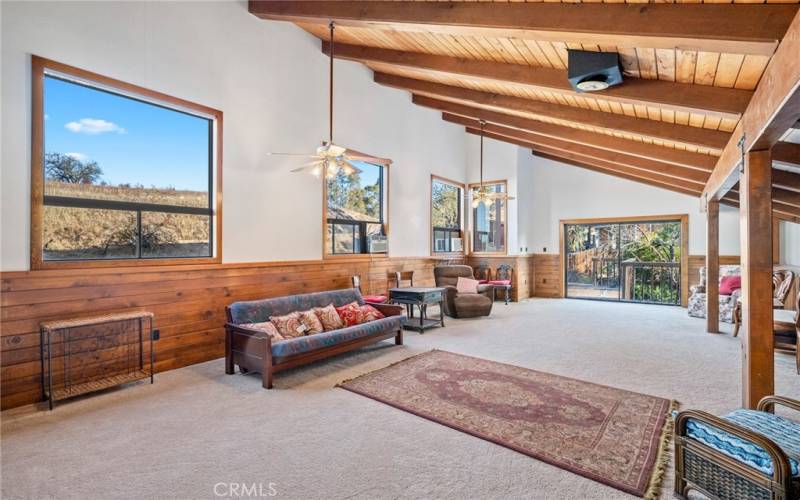 Loft area leads through sliding door to garden