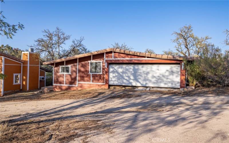 Detached garage w/ workshop on left