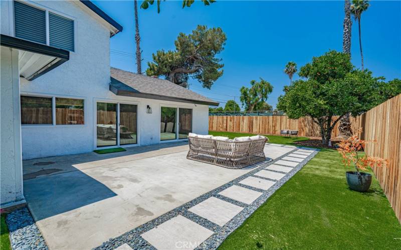 Backyard w/turf and new wooden fence