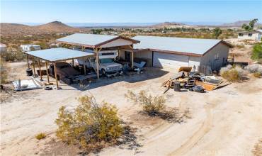 RV and carport w/ 4 car wide garage