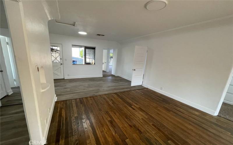 Door and window overlooks private backyard. Bedrooms to the right, kitchen to the left.