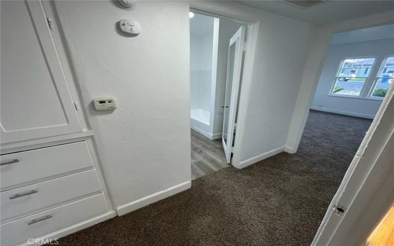 Hallway to bedroom. Living room to the right. Main bathroom to the left. 1st bedroom straight ahead.