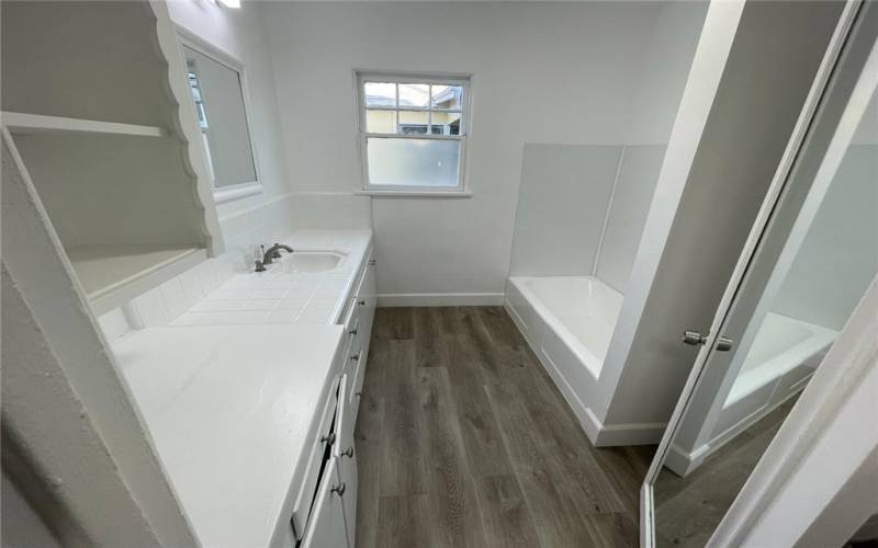 Main bathroom near bedrooms. Window faces west.