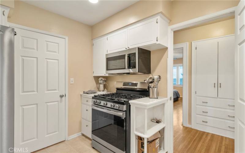 Kitchen with hallway linens drawers