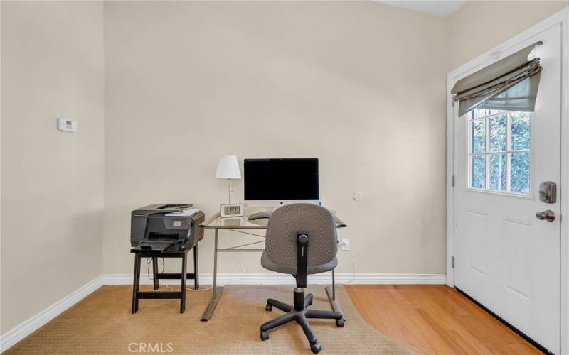 Primary bedroom is spacious enough for a computer desk and printer, with a separate entrance to the private backyard.