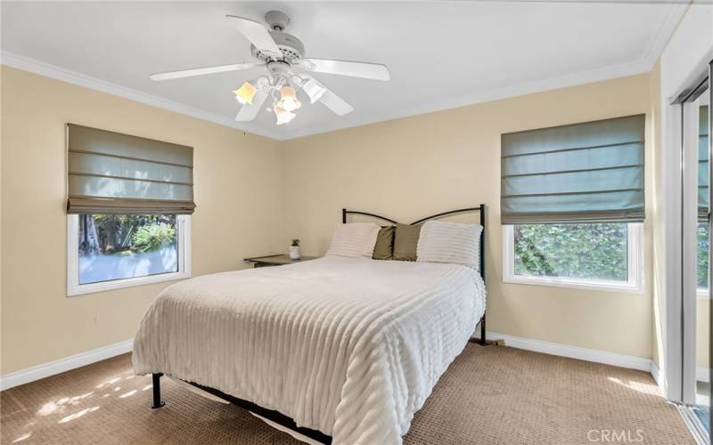 Bedroom #2 with carpeting and ceiling fan.