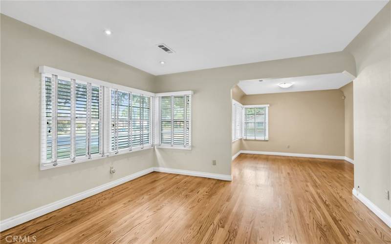 Alternate view of living room with view into the formal dining room