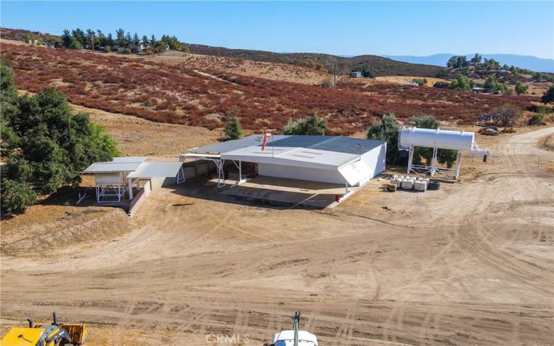 View of Hangar, fuel tanks (on left) and water tower (on right, not included)