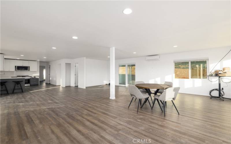 Main living room with entry to both front and rear of home