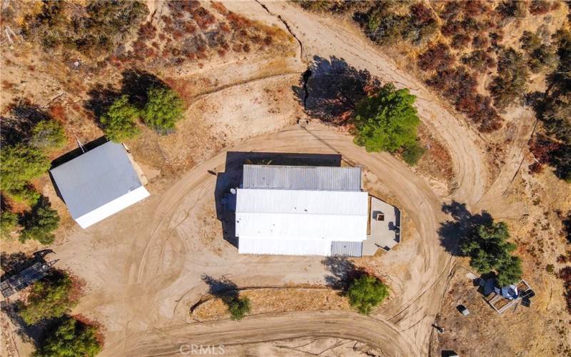 Ariel view of home with outbuilding with covered parking