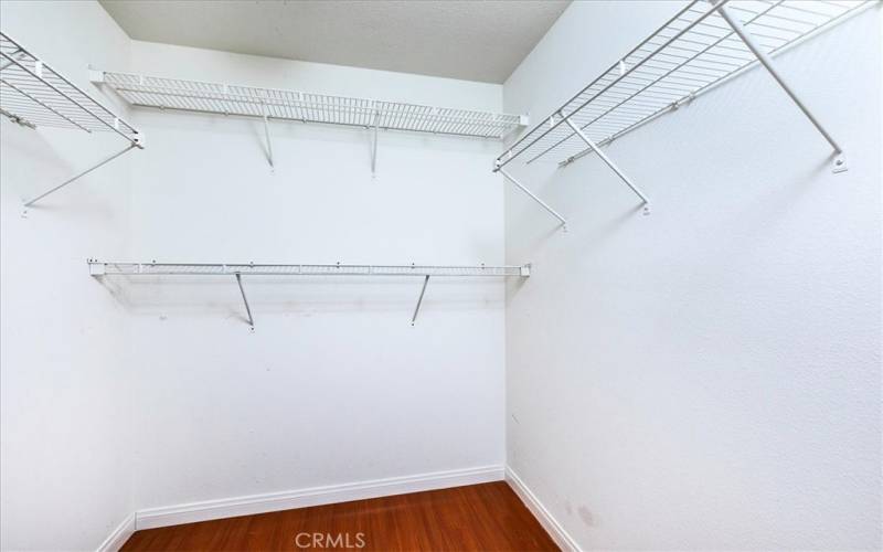 Large walk-in closet in primary bedroom.