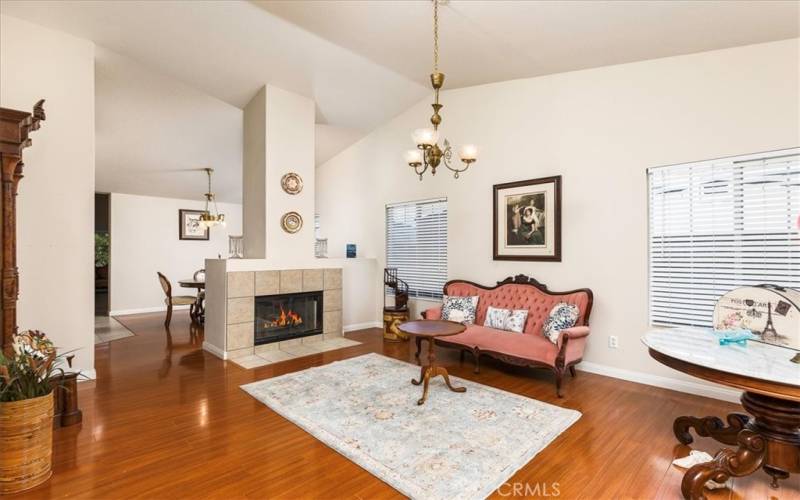 Front living space with gas fireplace.  Opens to formal dining room on other side.