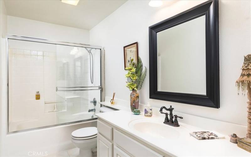 Hall Bath with upgraded mirror and fixtures.