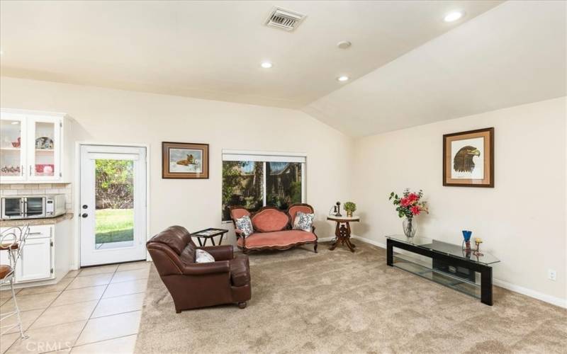 Family room is open to kitchen.  French door leads to spacious back yard.