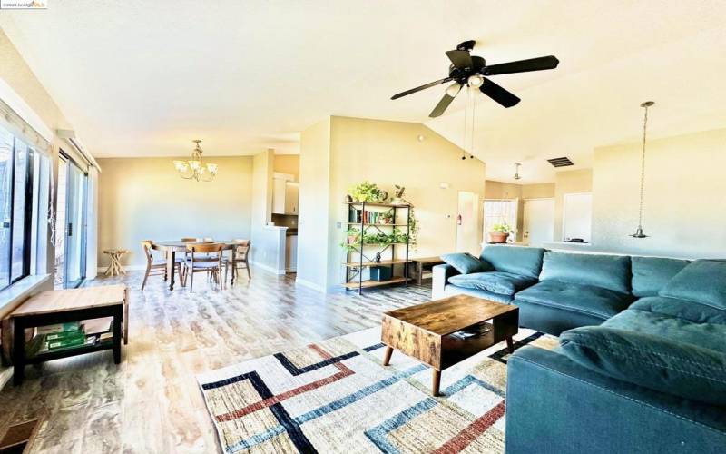 Open Living Room with Vaulted Ceilings and beautiful laminate flooring