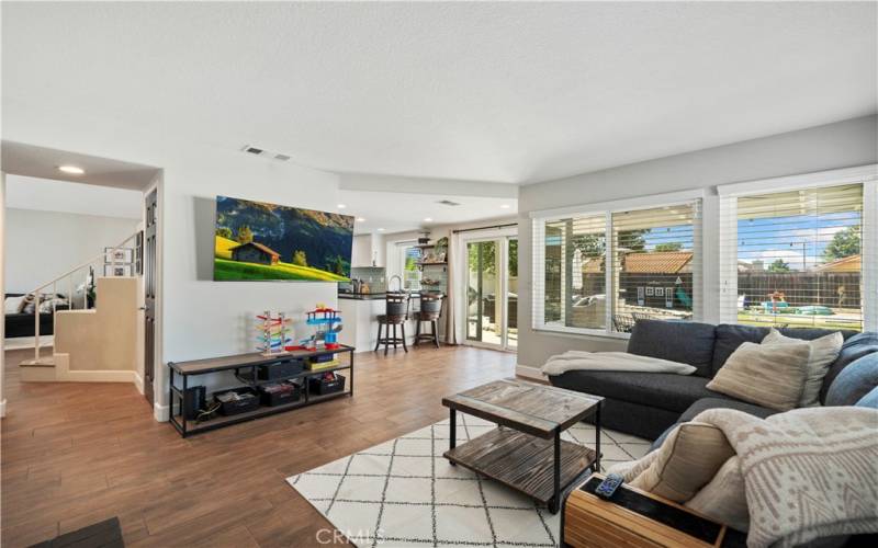 Family room looking into kitchen and living room area