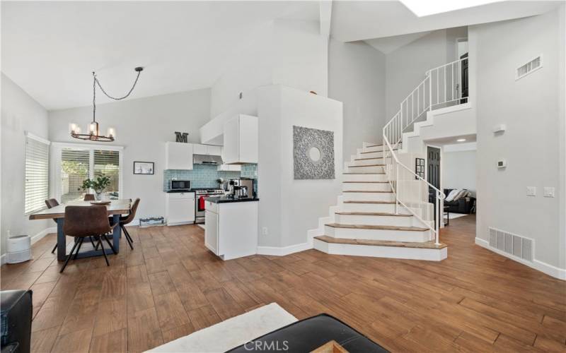 living room looking into dining area and kitchen