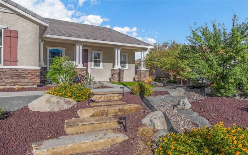 Drought tolerant front yard with synthetic grass