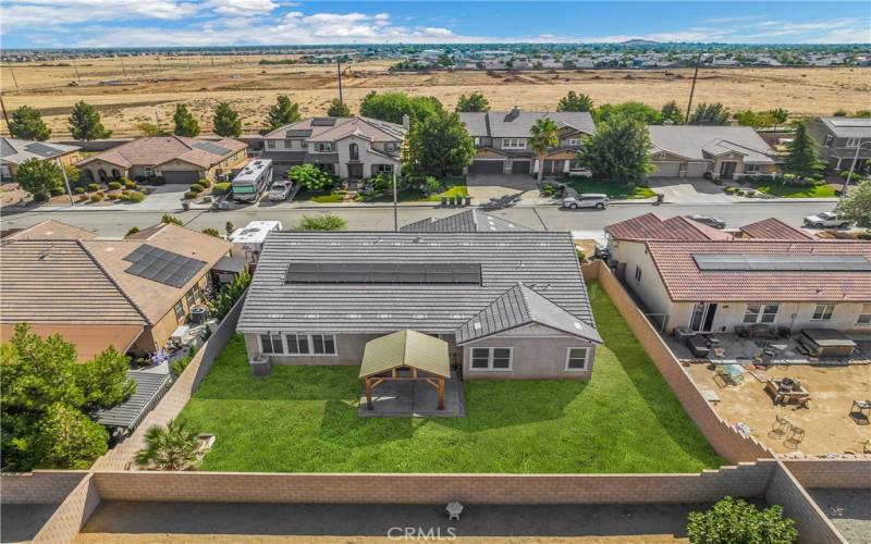 Virtually staged side yard and backyard grass