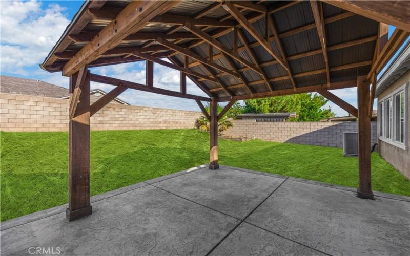 Virtual backyard grass. Stamped Concrete Slab and Covered Patio