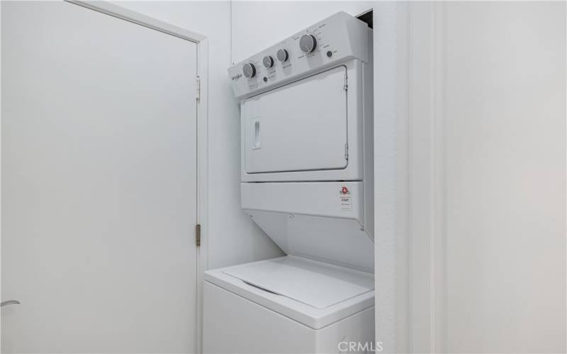 Laundry area off of the kitchen by garage door entrance.