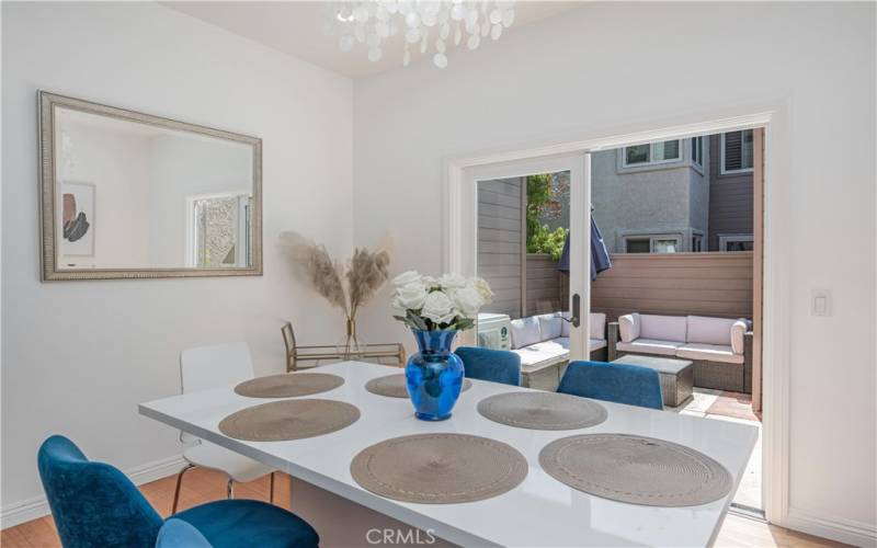 The dining area opens to the patio through double doors.