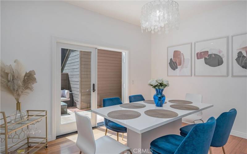 The dining area opens to the patio through double doors.