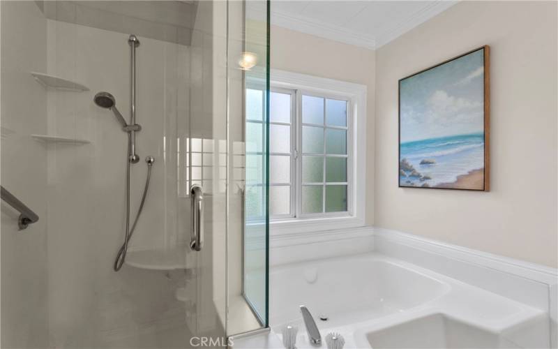 The primary bathroom has a soaking tub and separate walk in shower.