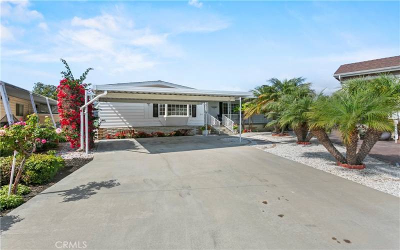 This home has an extra long driveway and double wide carport.