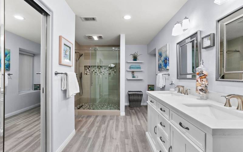 Recently updated primary bath includes an oversized walk in shower