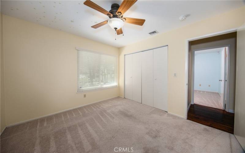 Bedroom with ceiling fan.