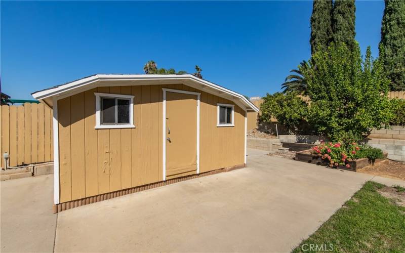 Shed on side of the yard that has a ton of storage space.