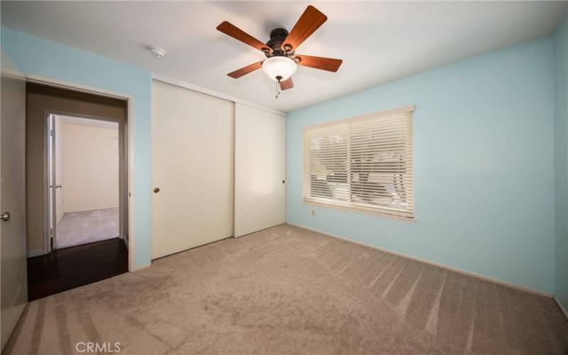 Bedroom with ceiling fan.