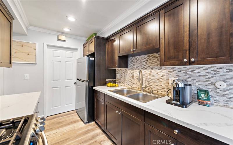 Quartz counters and chocolate cabinets!