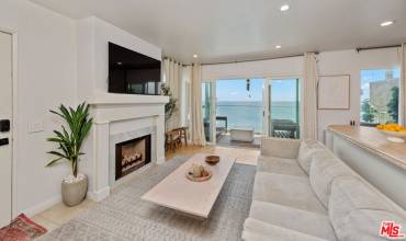 Main Living Area | Decorative Fireplace | Ocean Front Balcony