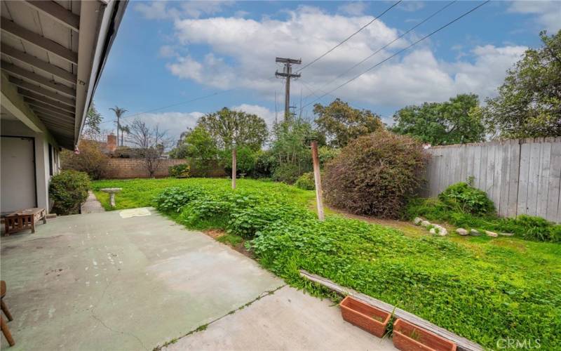 Backyard patio and grass area