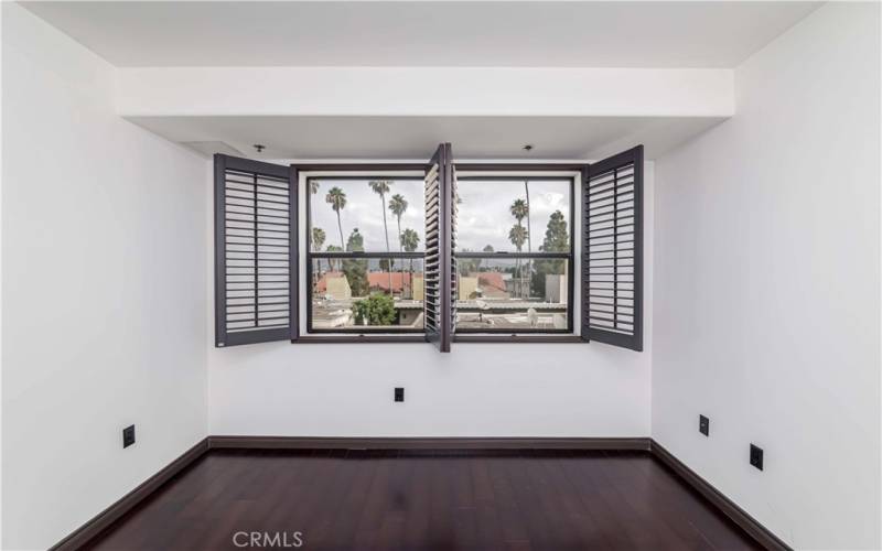 Gorgeous City Light & Palms Views w Wood Shutters