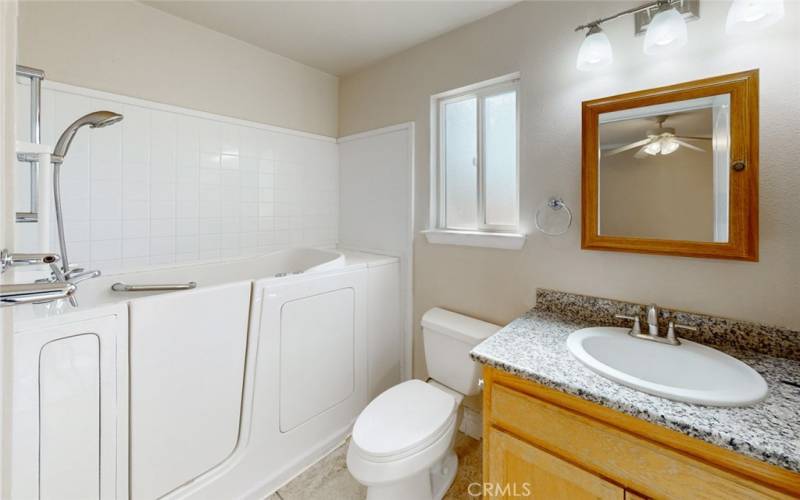 Main bath with walk-in tub/shower combo.
