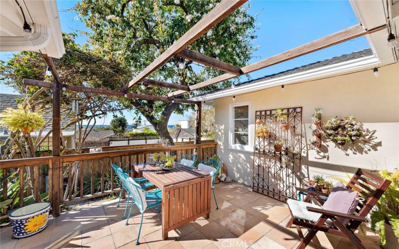 Enjoy breakfast or sunsets from this patio