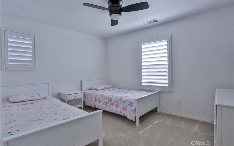 Bed 2: Upstairs. Plantation shutters, carpet, ceiling fan