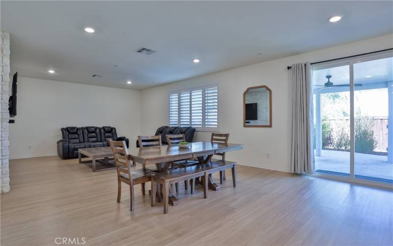 View of living/dining area from the kitchen. Beautiful laminate flooring throughout most of the downstairs.