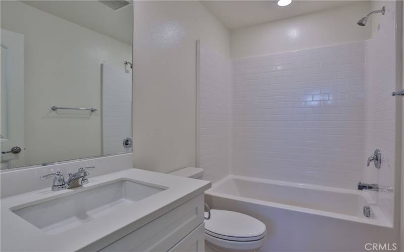 Bath 2: Upstairs in hallway, tub/shower combo