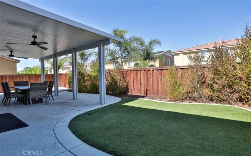 View of artificial turf in back yard.