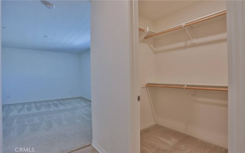 Primary bedroom with 2 walk in closets