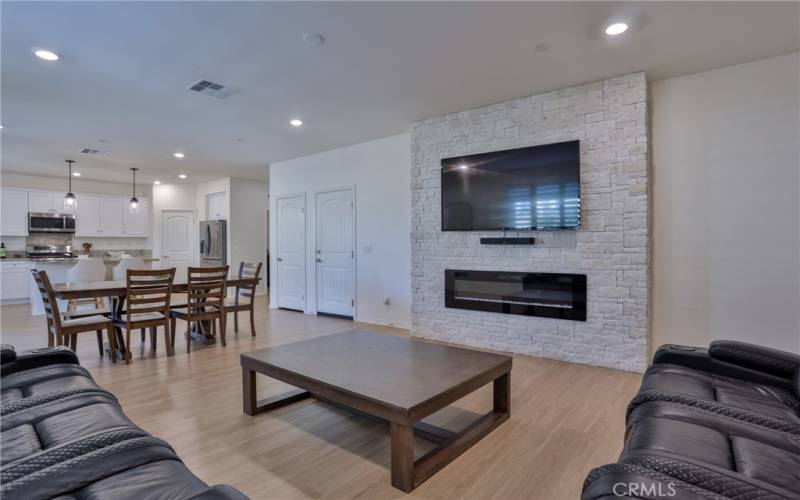 View of the electric fireplace and garage door access