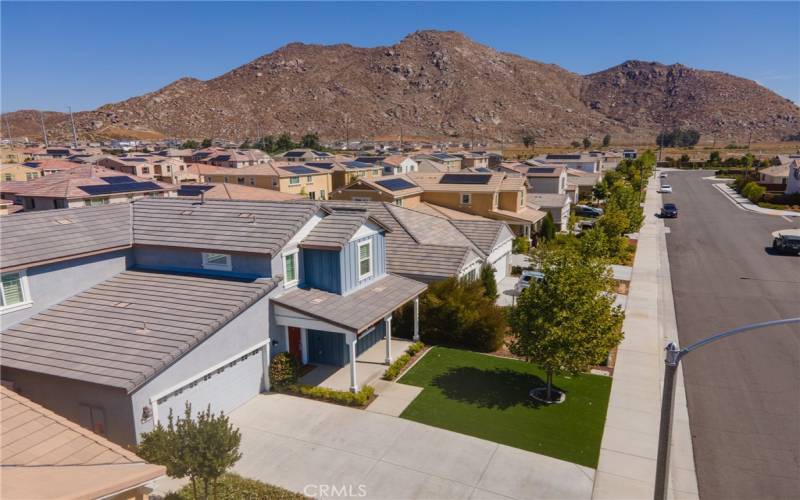 Drone view of front of the home with the beautiful foothills in the background